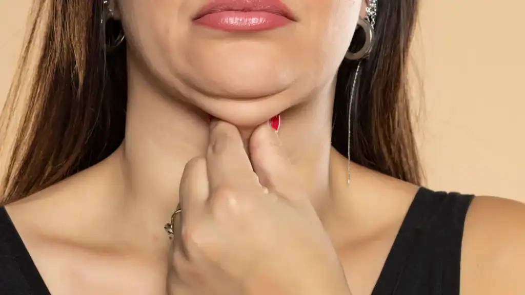 An image of a woman with double chin, sad, worried : Non Surgical Double Chin Removal Treatment in Hertford, UK